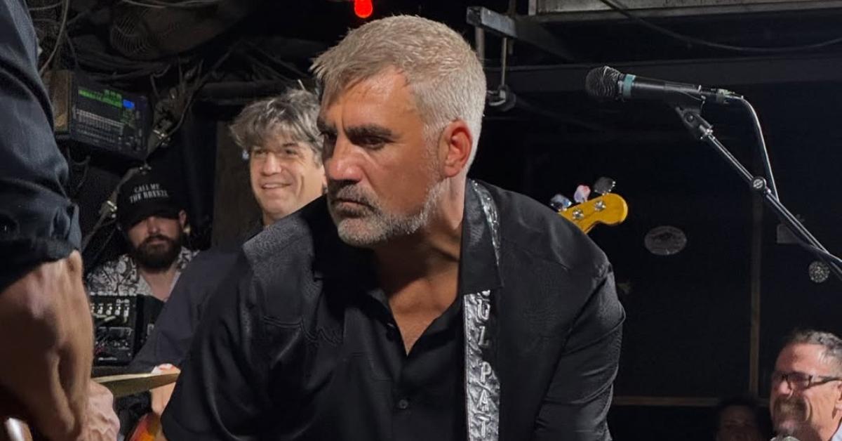 Taylor Hicks performing with his guitar.