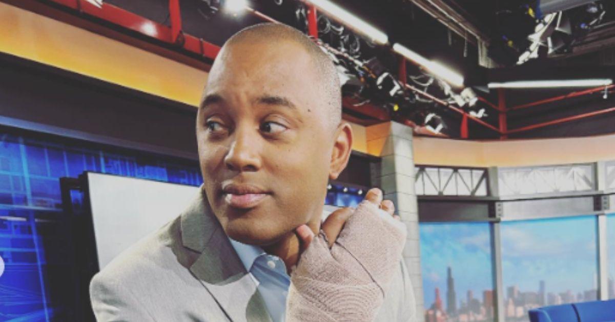 Demetrius Ivory poses with his injured hand in the TV studio