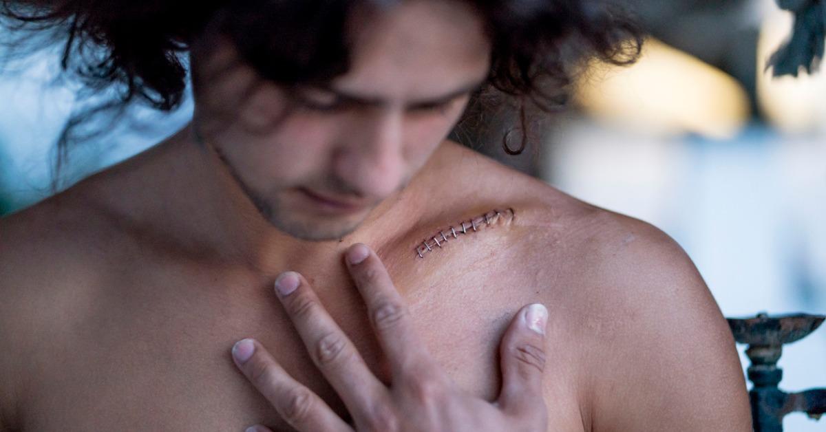 handsome latin guy with a scar on the clavicle picture id