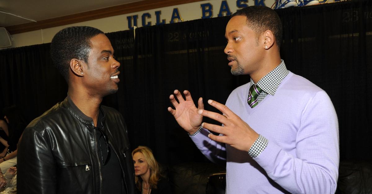 Chris Rock in leather jacket and Will Smith in purple sweater talking in 2010 at the Nickelodeon's 23rd Annual Kid's Choice Awards 