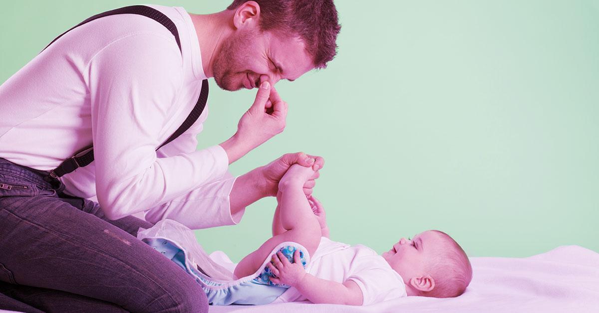 Dad changing baby store diapers