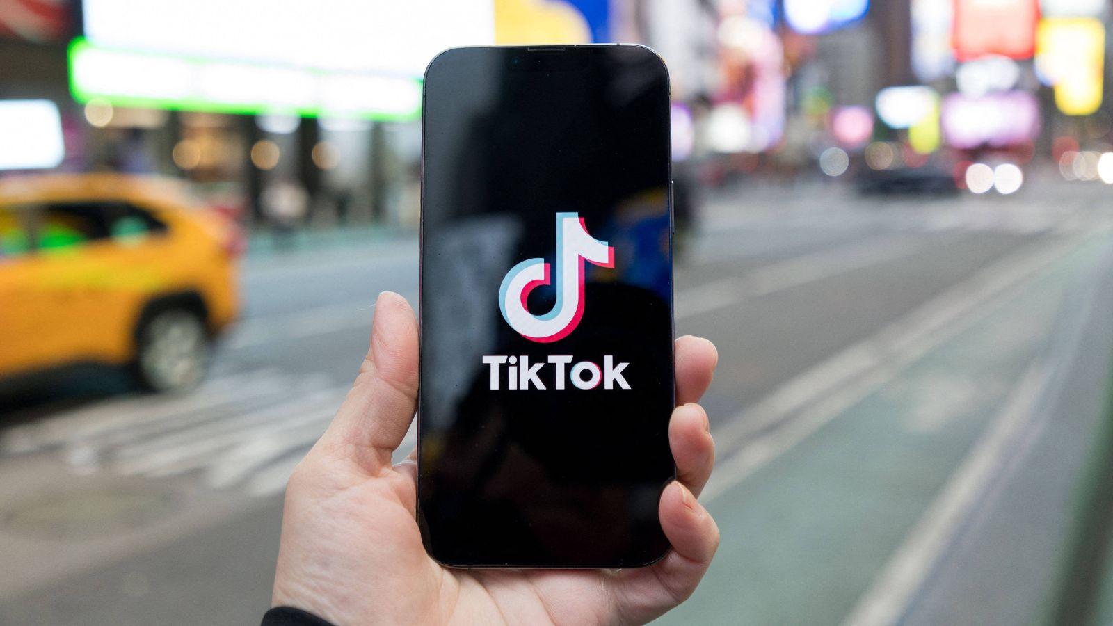 The TikTok logo on a phone in New York City. 