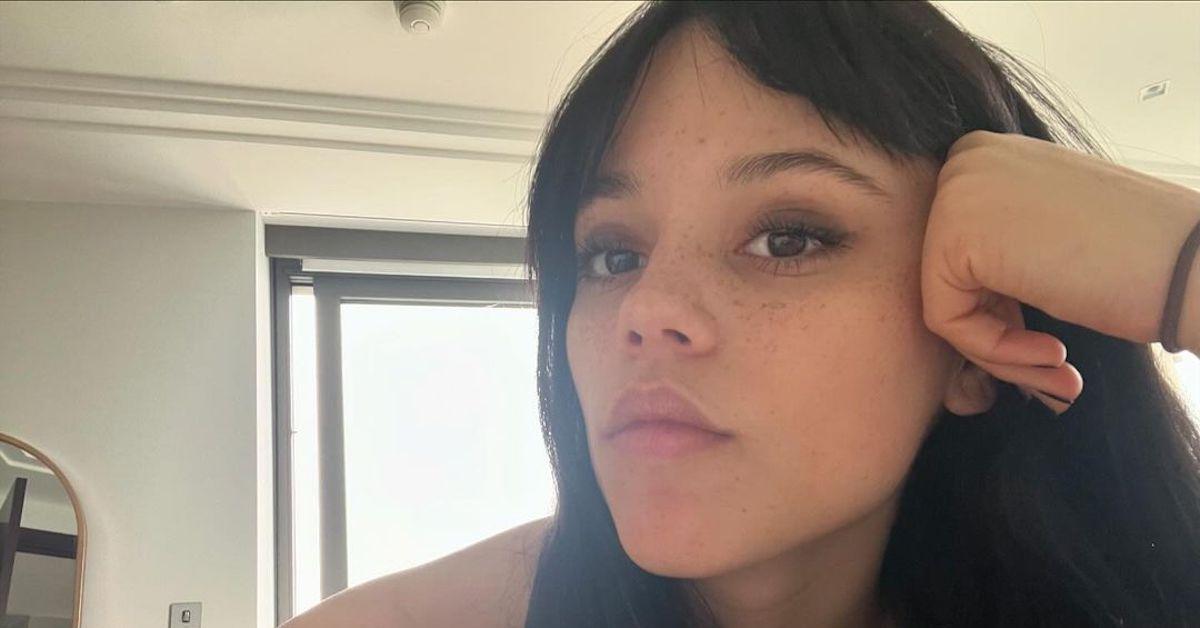 Jenna Ortega in an up-close selfie with a serious expression 