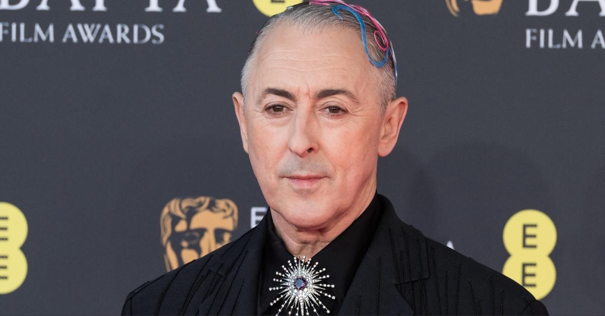 Alan Cumming arrives at the 2026 BAFTAs.
