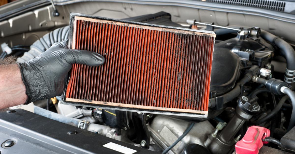 removing a dirty automotive air filter picture id