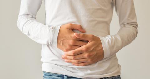 young man suffering from stomach ache diarrhea constipation acid picture id