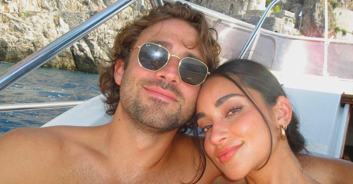 Greg Grippo and Victoria Fuller pose together on a boat in Italy.