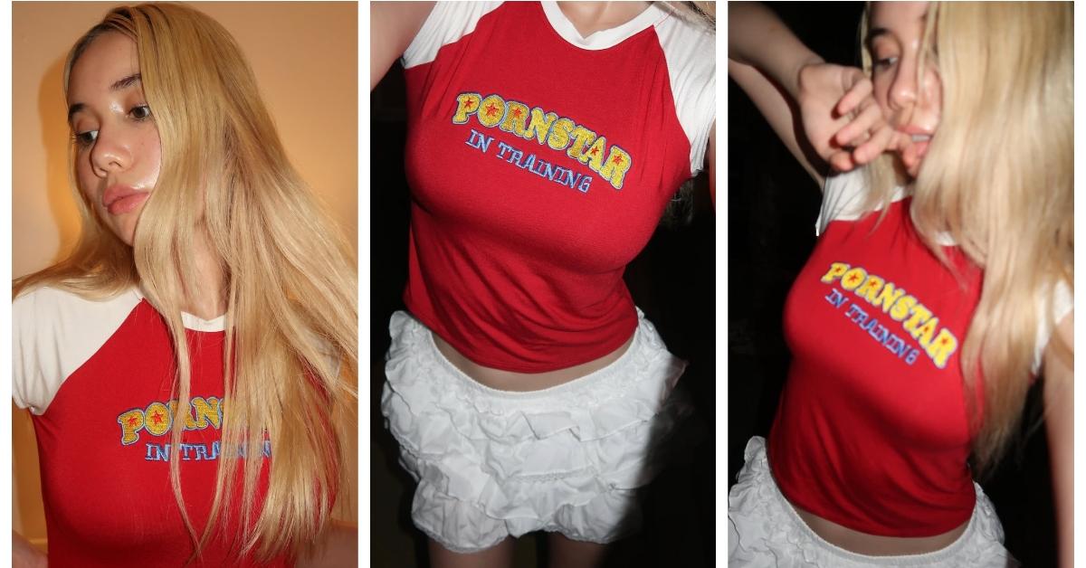 Lil Tay posing in a t-shirt that reads, "Pornstar in training".