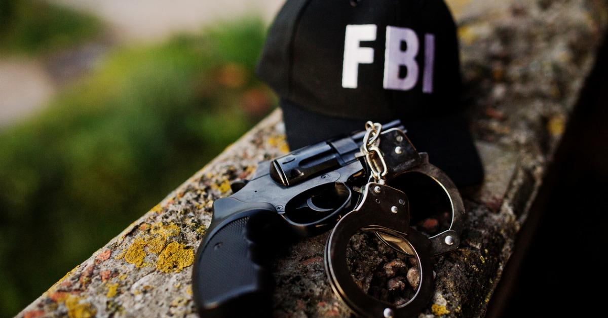 cap with revolver and handcuff picture id