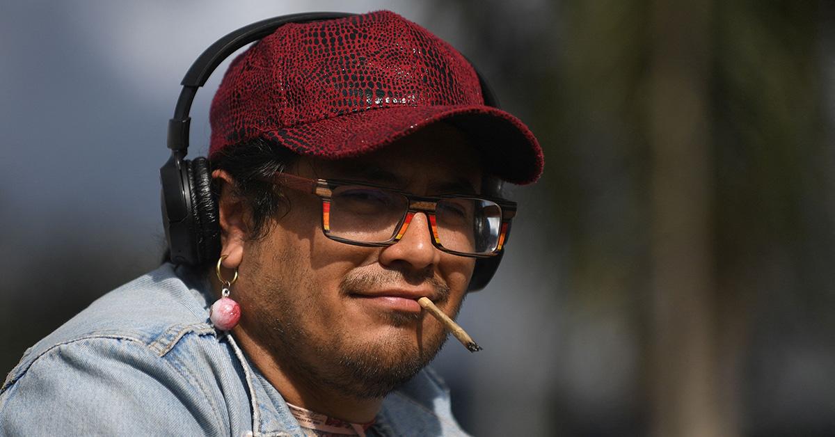 A man smoking a joint at the Colombia Marijuana Festival. 