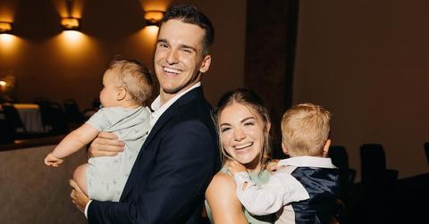 Matt and Abby with their kids at a friend's wedding