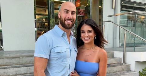 Anthony Bass and his wife, Sydney Rae Bass, matching in blue