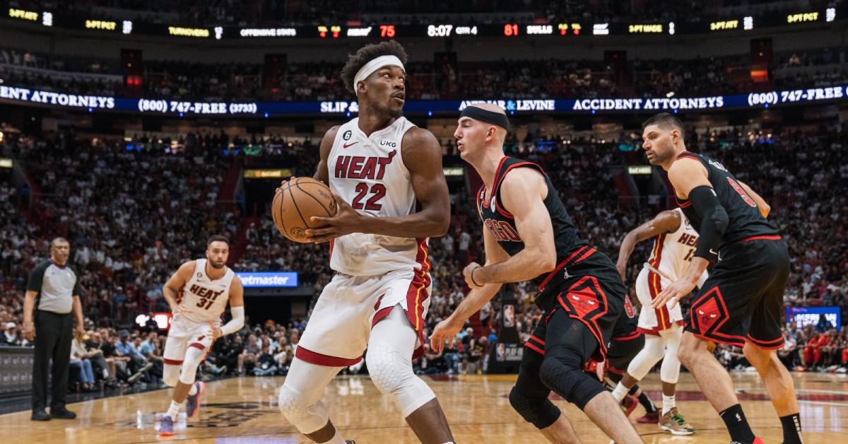 Jimmy Butler of the Miami Heat guarded by Alex Caruso of the Chicago Bulls in a 2023 play-in game.