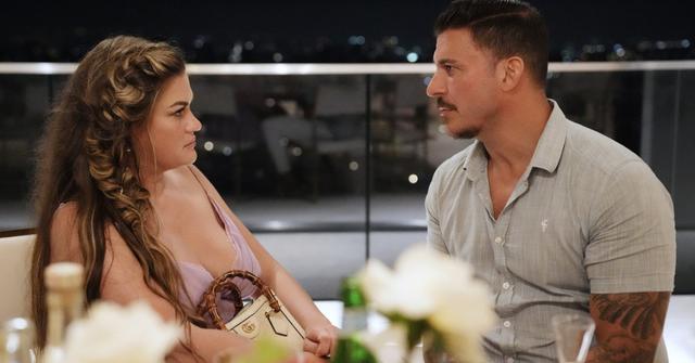 Brittany and Jax on a patio on The Valley