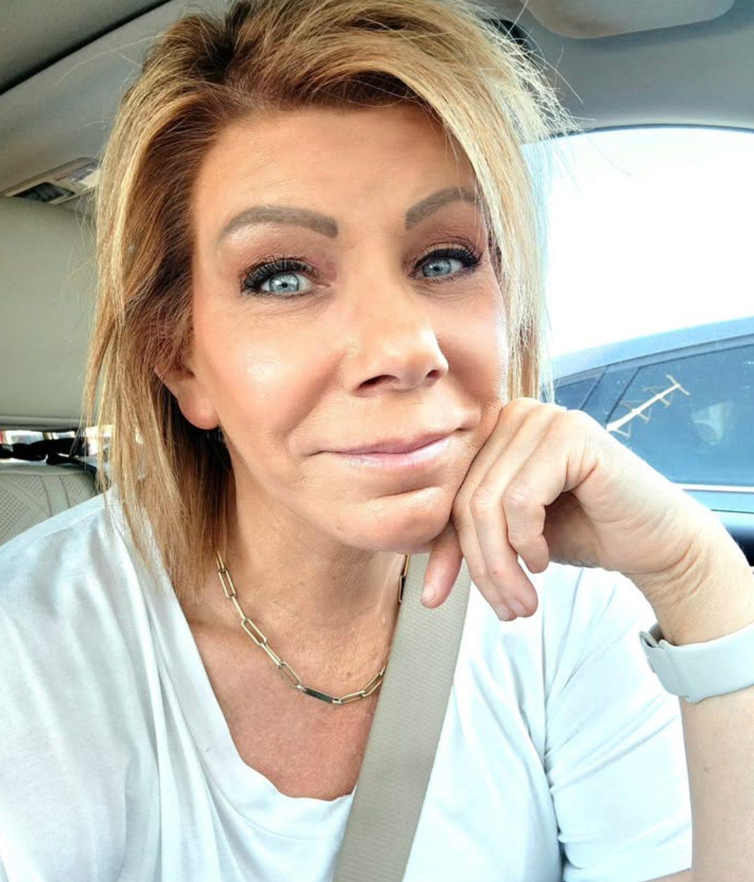 Meri Brown sitting in her car.