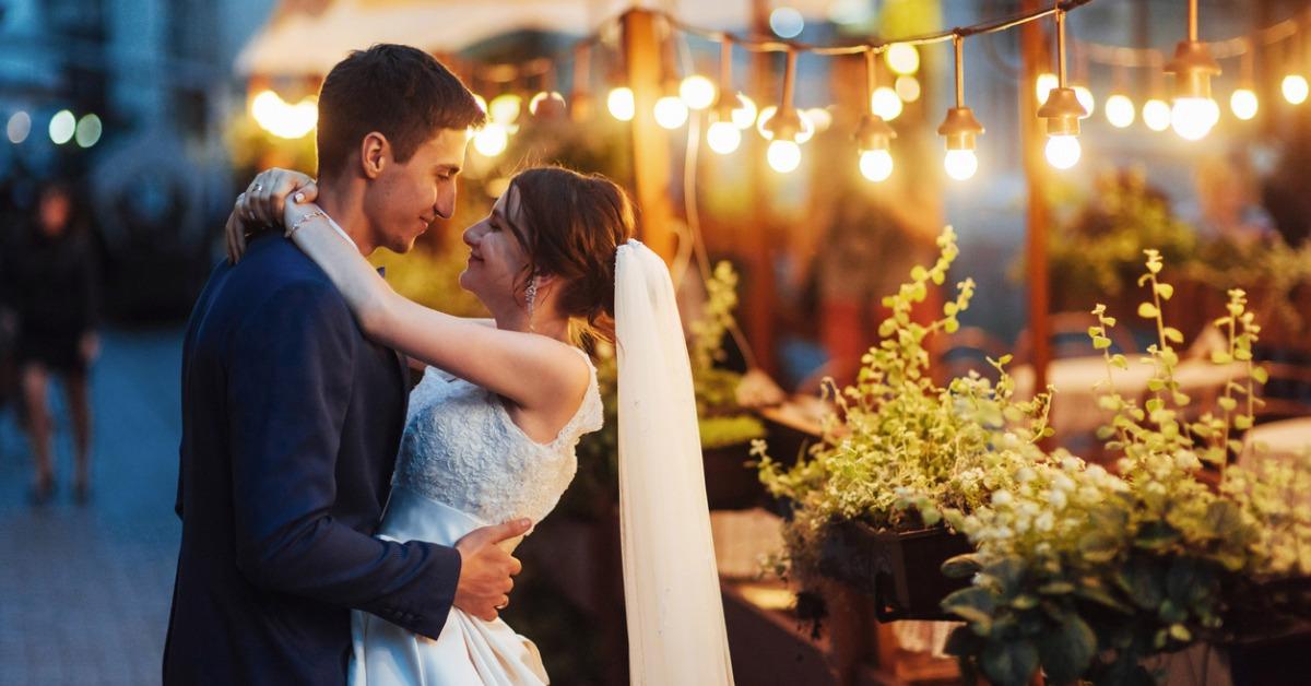 wedding couple at night lighting cafe along with decoration lig picture id