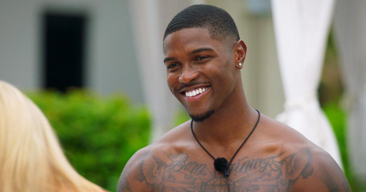 A shirtless Demari smiles at Gianna in Season 6 of ‘Too Hot to Handle.’