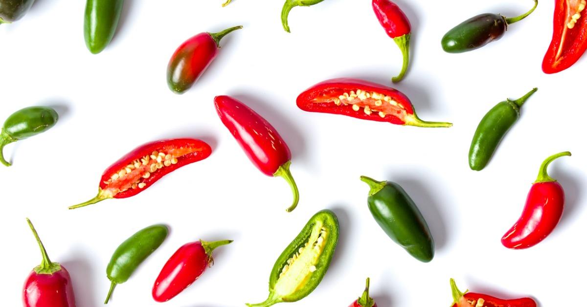 colorful jalapenos peppers on white background picture id