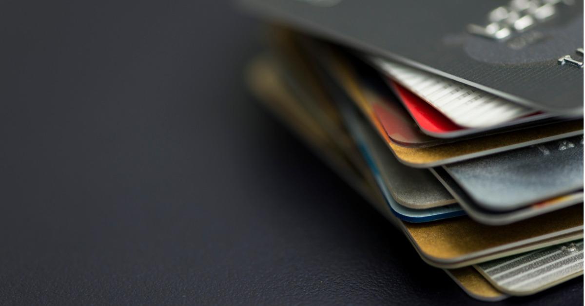 stack of multicolored credit cards closeup picture id