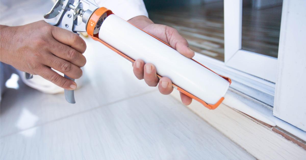 construction workers install doors windows and use silicon and picture id