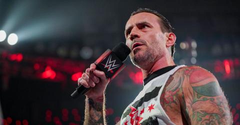 CM Punk with a microphone on WWE