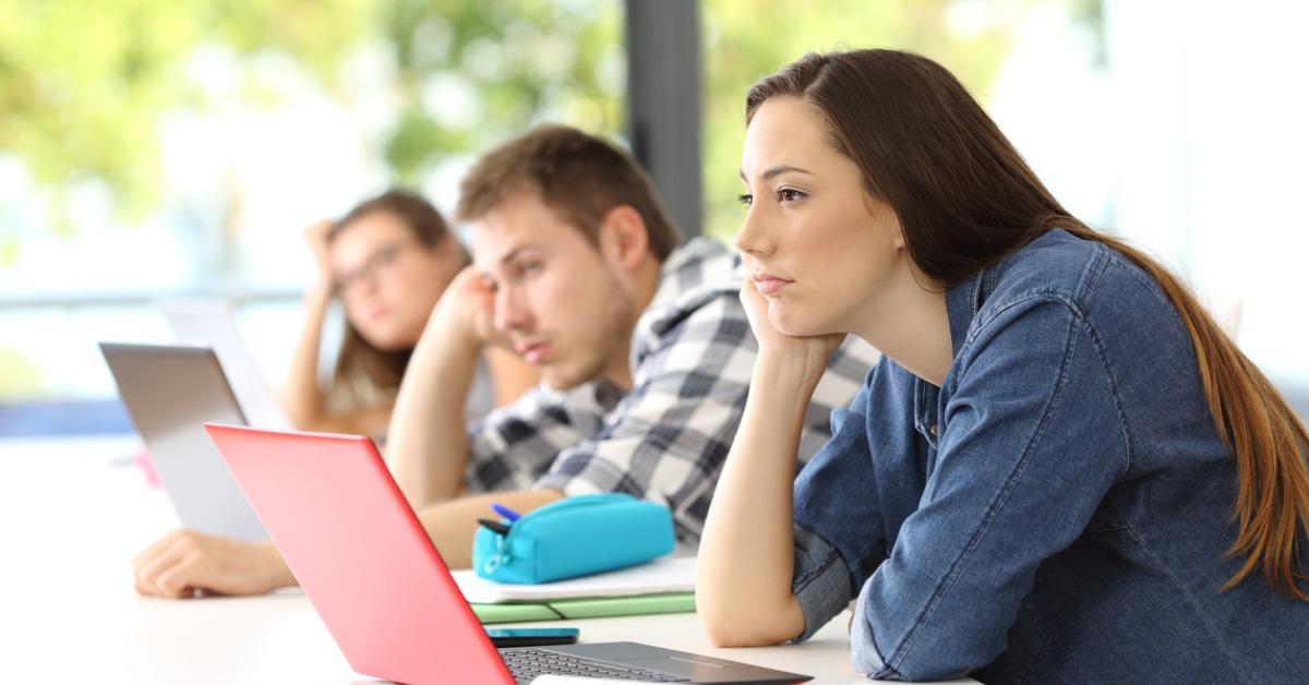 bored students listening lesson in a classroom picture id