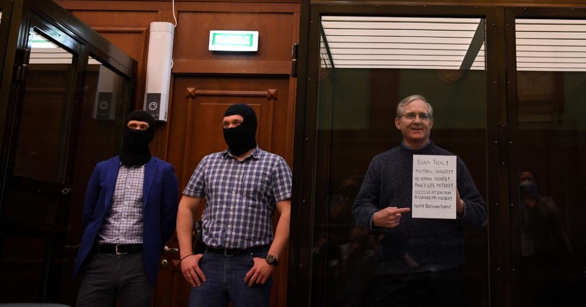 Paul Whelan stands inside a defendants' cage as he waits to hear his verdict