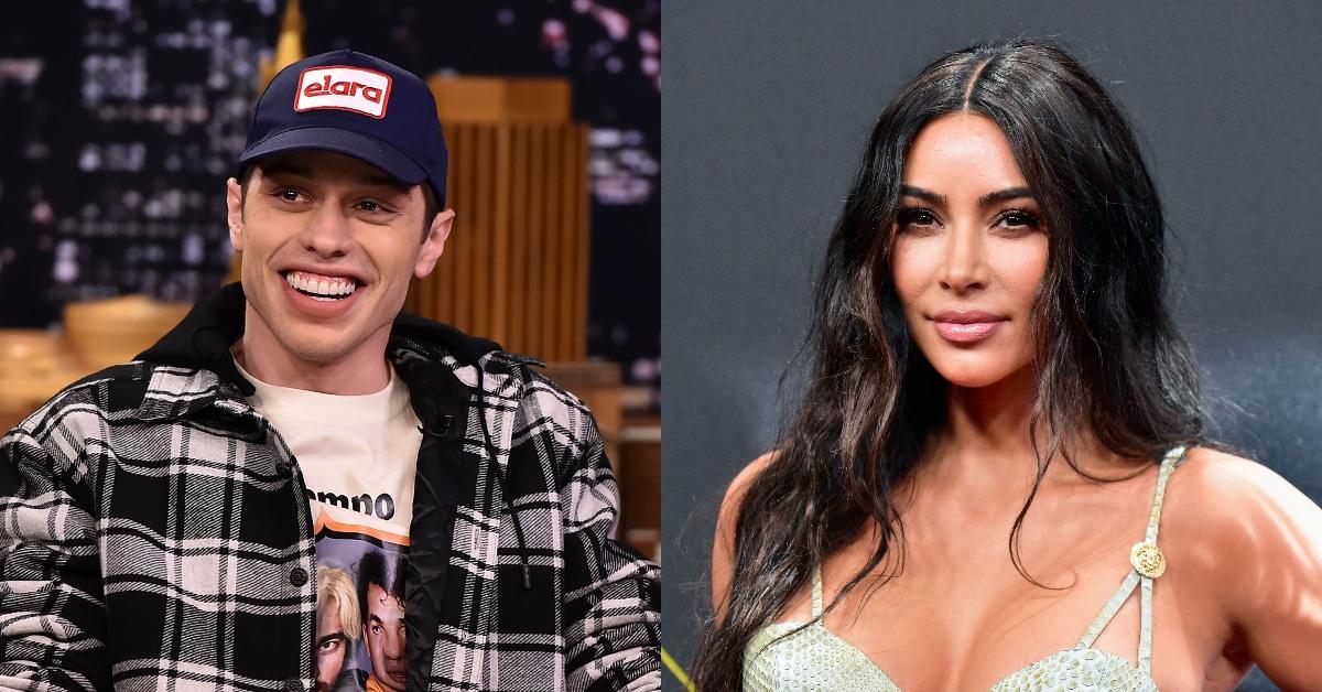 Pete Davidson wearing a blue elara hat and Kim Kardashian in a snake skin-patterned top.