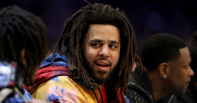 J. Cole talking on the sidelines at the 2019 NBA All-Star Game