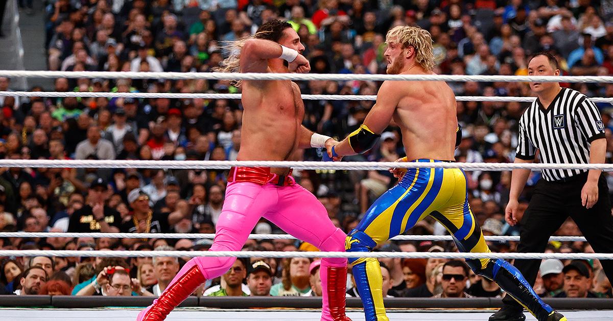 Seth Rollins and Logan Paul duke it out in the WWE ring. 