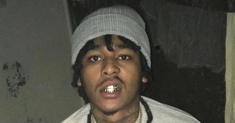 Yatta Bandz shows his grill in jail.