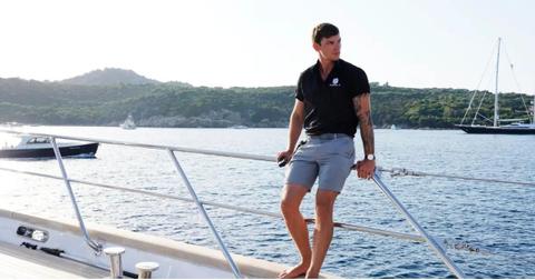 Deckhand Chase Lemacks leans against the railing of the Parcival III