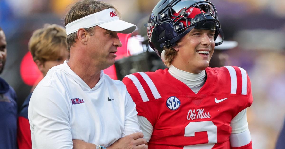 Lane Kiffin coaching one of his players