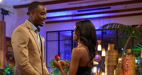 Xavier accepting a rose from Charity on The Bachelorette