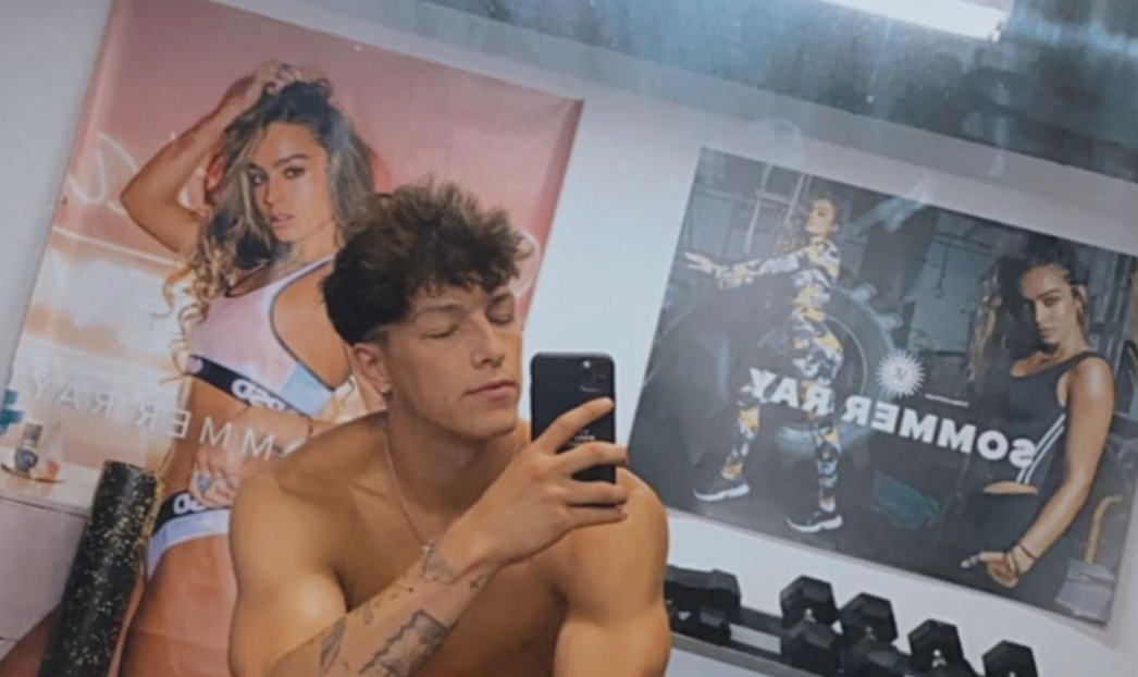 Tayler Holder with Sommer Ray posters in the Background