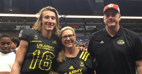 Trevor Lawrence standing with his parents.