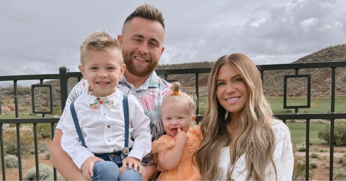 Jordan and Jessi Ngatikaura pose for a family photo. Jordan holds their son, and Jessi holds their daughter