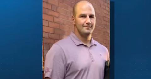 Michael Proctor, lead investigator in the John O'Keefe murder, stands by a brick wall