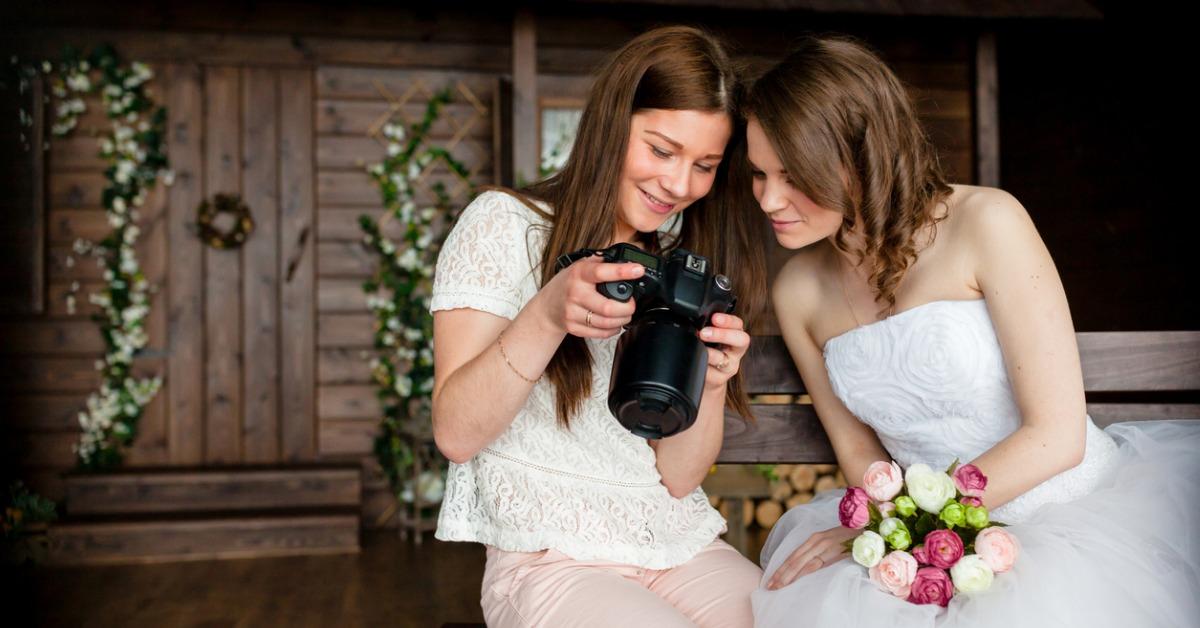 photographer shows the bride had just taken photos picture id