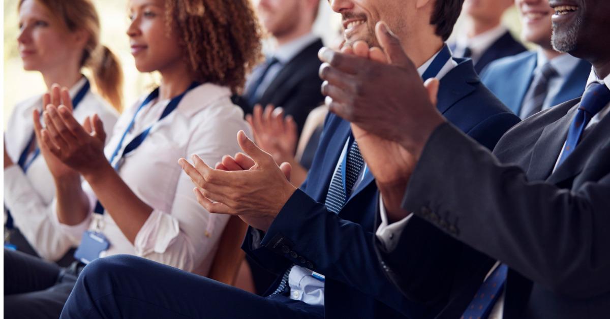 mid section of applauding audience at business seminar picture id