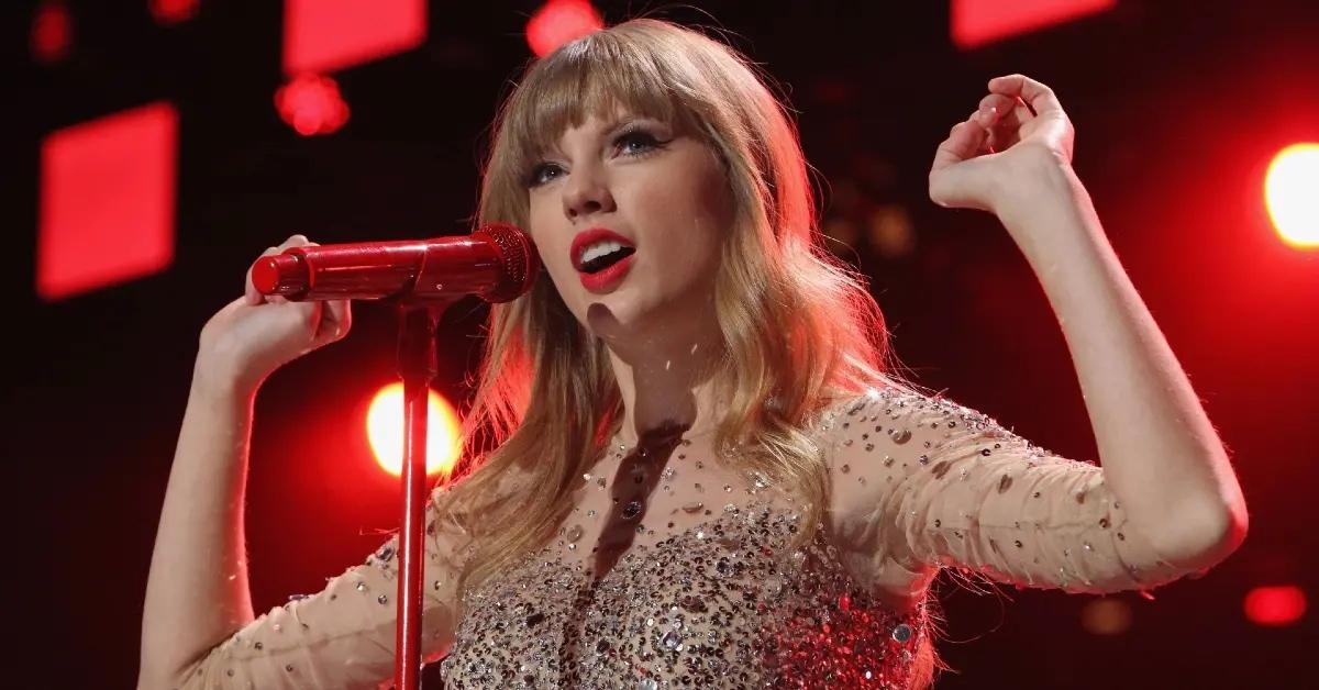 Taylor Swift performing during The Red Tour. 