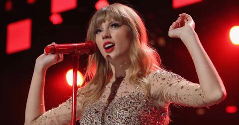 Taylor Swift performing during The Red Tour.