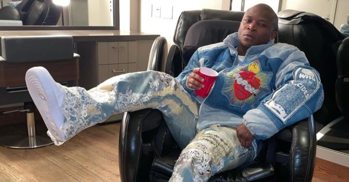 O.T. Genasis sitting a chair.