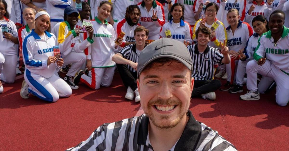 MrBeast dressed as a ref with country representatives behind him. 