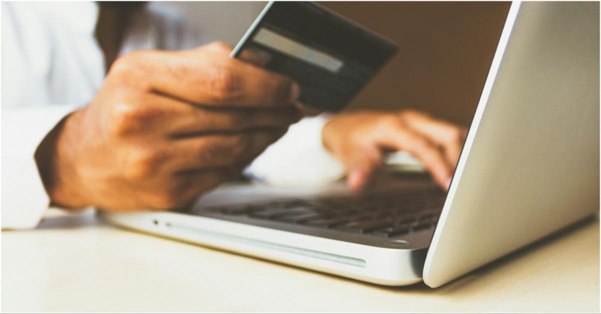 A man shopping online with his credit card