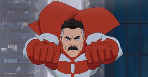 Omni-man flying through the air.