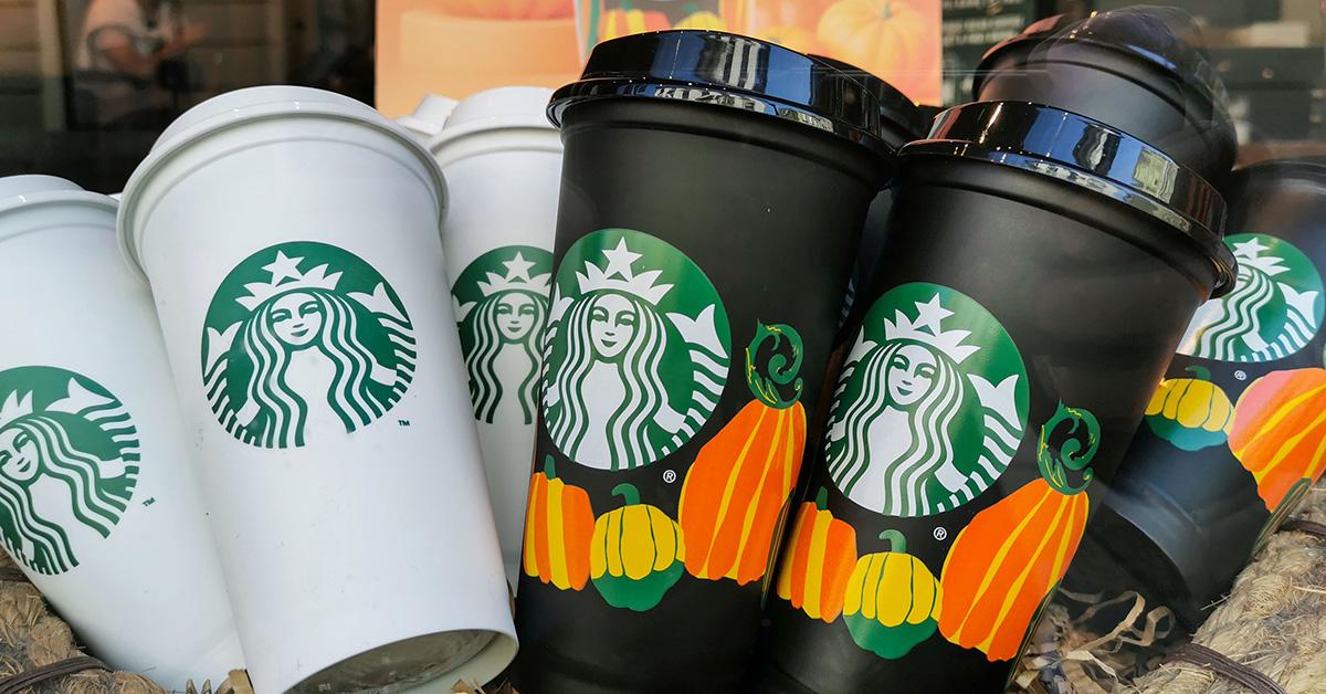 Starbucks cups, including some that feature pumpkins on them. 