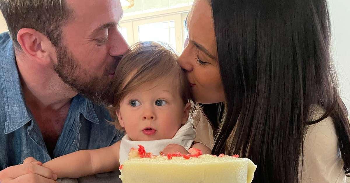 Nikki Garcia and Artem Chigvintsev kissing their son