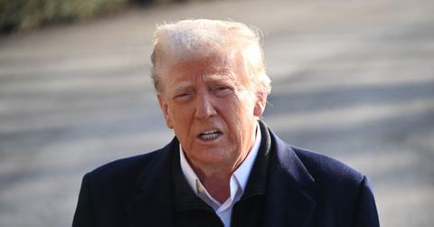 Donald Trump grimacing outside.