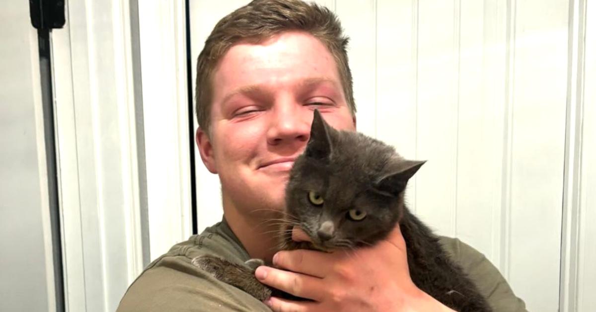 Garrison Brown with his cat Ms Buttons